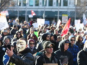 Hundreds gather in Municipal Plaza in downtown Calgary on Saturday, Nov. 28, 2020, to protest mandatory masks and COVID-19 restrictions.