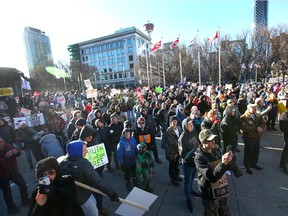 Hundreds of upporters gather during a large rally in Municipal Plaza in downtown Calgary on Saturday, November 28, 2020. About 1000 participants, from a few different groups were opposed to a number of things-the federal, provincial and civic governments, anti-masking, and end the lockdown. The group eventually marched up and down Stephen Ave Mall. Jim Wells/Postmedia