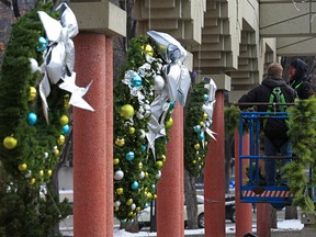 It was beginning to look a little like Christmas as workers added seasonal decorations around Calgary's Olympic Plaza on Wednesday, November 18, 2020.