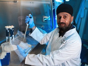 CardiAI CEO Dr. Anmol Kapoor simulates a test in the company's lab where a team of doctors and chemists have developed CoviLamp, the fastest and most accurate COVID-19 rapid test. He was photographed in the Calgary lab on Thursday, November 19, 2020.