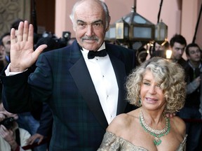 In this file photo taken on December 7, 2004 Sean Connery and his wife, Micheline Roquebrune, arrive for the presentation of "Alexendre" during the 44th International Film Festival in Marrakesh.