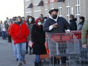 A steady stream of shoppers at the Beacon Hill Costco as COVID cases continue to rise in Calgary on Monday, November 23, 2020.