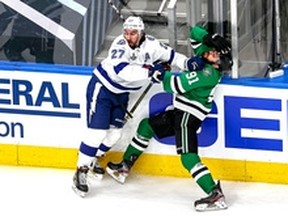 Ryan McDonagh (left) of the Tampa Bay Lightning checks Tyler Seguin of the Dallas Stars during Game 6 of the Stanley Cup Final. It's still unclear whether the Lightning will have a chance to defend their title in 2020-21.