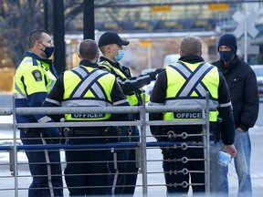 Peace officers in Calgary on Wednesday, November 25, 2020.