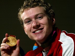 Kyle Shewfelt shows off his gold medal.