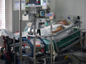 A lung machine is seen in a patient's room in the COVID-19 intensive care unit of the university hospital in Essen, Germany, Oct. 28, 2020.