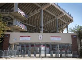 In this photo from April 18, Gate 2 at Memorial Stadium sits quiet as the lines of Nebraska fans who would have attended the spring NCAA college football game are nowhere to be seen in Lincoln, Neb. The annual Red-White matchup was cancelled due to the COVID-19 pandemic.