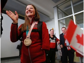 Canadian para nordic Olympian Brittany Hudak waves as she is welcomed home at the Calgary International Airport on Monday March 19, 2018. Hudak was a double bronze medallist at the 2018 Paralympics. Hudak won a bronze medal in biathlon at the 2018 Paralympics. Gavin Young/Postmedia