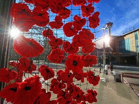 Some of the thousands of crocheted and knitted Remembrance Day poppies outside the Cathedral Church of the Redeemer in downtown Calgary on Monday, November 9, 2020.
