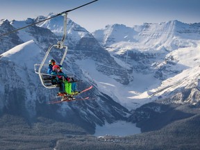 Skiers on the new Summit lift at Lake Louise Ski Resort with Mt. Victoria and Château Lake Louise in the background on Sunday, Nov. 22, 2020.