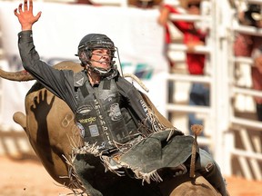 Ty Pozzobon, of Merritt, B.C., is pictured competing during the 2014 Calgary Stampede. The bull rider took his own life in 2017; his family suspected his death was the result of repeated head injuries and concussions.