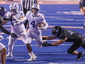 BYU Cougars running back Lopini Katoa runs through the tackle of Boise State Broncos linebacker Riley Whimpey at Albertsons Stadium in Boise, Idaho, on Nov. 6, 2020.