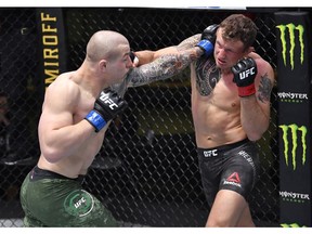 LAS VEGAS, NEVADA - DECEMBER 05: In this handout image from the UFC, Marvin Vettori (L) of Italy and Jack Hermansson of Sweden trade punches in a middleweight bout during the UFC Fight Night event at UFC APEX on December 05, 2020 in Las Vegas, Nevada.