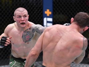 Marvin Vettori of Italy punches Jack Hermansson of Sweden in a middleweight bout during the UFC Fight Night event at UFC APEX on December 05, 2020 in Las Vegas, Nevada.