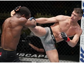 Stephen Thompson kicks Geoff Neal in a welterweight fight during the UFC Fight Night event at UFC APEX on December 19, 2020 in Las Vegas, Nevada.