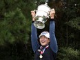 A Lim Kim of Korea celebrates with the trophy after winning the 75th U.S. Women's Open Championship at Champions Golf Club Cypress Creek Course on December 14, 2020 in Houston, Texas.