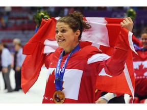 Team Canada's Rebecca Johnston celebrates a gold medal after Canada defeated the U.S. 3-2 in overtime during the Ice Hockey Women's Gold Medal Game at the Sochi 2014 Winter Olympics in this photo from Feb. 20, 2014.