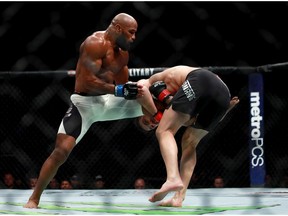 Yoel Romero of Cuba fights against Chris Weidman of the United States in their middleweight bout during the UFC 205 event at Madison Square Garden on November 12, 2016 in New York City.