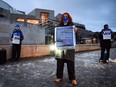 Anti-Brexit pro-Scottish independence activists gather for a small protest against Britain's exit from the European Union outside the Scottish Parliament in Edinburgh on Dec. 31, 2020 hours before the end of the Brexit transition period.
