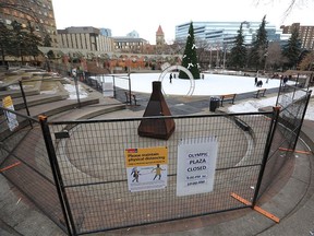 Calgary’s Olympic Plaza ice rink is now fenced off with defined opening and closing times as seen on Monday, November 30, 2020.