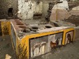 Frescoes on an ancient counter discovered during excavations in Pompeii, Italy, are seen in this handout picture released Dec. 26, 2020.