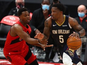 New Orleans Pelicans guard Eric Bledsoe (5) moves to the basket as Toronto Raptors guard Kyle Lowry (7) defends during the second half at Amalie Arena.