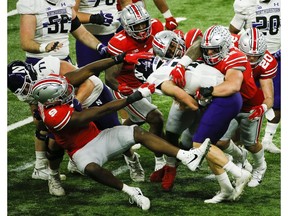 Dec 19, 2020; Indianapolis, IN, USA; Ohio State Buckeyes linebacker Tuf Borland (32) and Ohio State Buckeyes defensive tackle Taron Vincent (6) sack Northwestern Wildcats quarterback Peyton Ramsey (12) during the third quarter of the Big Ten Championship football game between the Ohio State Buckeyes and the Northwestern Wildcats on Saturday, Dec. 19, 2020 at Lucas Oil Stadium in Indianapolis. Mandatory Credit: Joshua A. Bickel-USA TODAY NETWORK ORG XMIT: IMAGN-444233