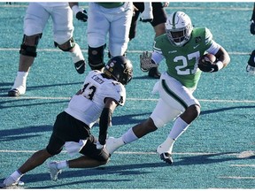 Dec 21, 2020; Conway, SC, USA;  North Texas Mean Green running back Oscar Adaway III  (27 )avoids Appalachian State Mountaineers defensive back Kaiden Smith (13) in the second quarter at Brooks Stadium. Mandatory Credit: David Yeazell-USA TODAY Sports ORG XMIT: IMAGN-439084