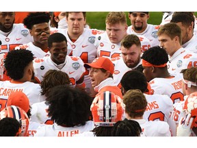 Clemson Tigers head coach Dabo Swinney speaks to players in a team huddle before the ACC Championship game against Notre Dame at Bank of America Stadium. Photo by Ken Ruinard/USA TODAY Sports.