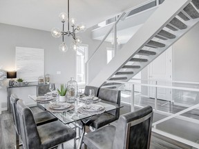 The stairs take centre stage in the Lavoy show home by Cedarglen Homes in Cranston's Riverstone.