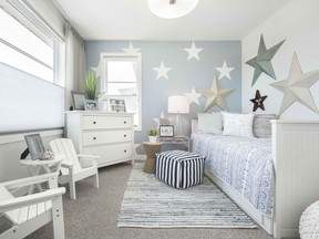 A bedroom in the Liam show home by Jayman Built in Precedence in Riversong, Cochrane.