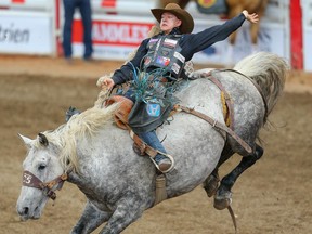 Big Valley, Alta. cowboy Zeke Thurston rides Rock Star to a score of 88.5 in Day 4 of the Calgary Stampede rodeo saddle-bronc event on July 8, 2019.