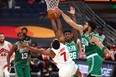 Boston Celtics forward Jayson Tatum blocks a shot by Toronto Raptors guard Kyle Lowry.