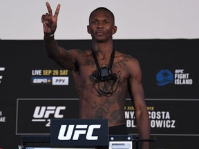 Israel Adesanya of Nigeria poses on the scale during the UFC 253 weigh-in on September 25, 2020 at Flash Forum on UFC Fight Island, Abu Dhabi, United Arab Emirates.