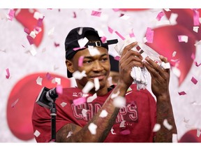 Alabama Crimson Tide receiver DeVonta Smith celebrates receiving Offensive Player of the Game, after leading his team to victory in the 2021 College Football Playoff Semifinal Game at the Rose Bowl Game presented by Capital One 31-42 over the Notre Dame Fighting Irish at AT&T Stadium on Friday in Arlington, Texas.