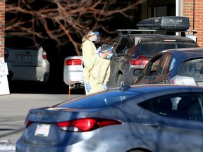 Nurses wearing PPE are seen outside the Richmond Road Diagnostic and Treatment Centre assisting patients with their COVID-19 tests. Friday, January 22, 2021.