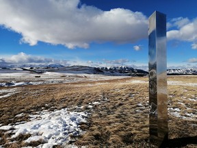 A monolith in Alberta is shown in a recent handout photo. A tall, stainless steel beacon that has been placed along the eastern slopes of the Alberta Rockies comes with a message.
The three-metre monolith, which reflects its surroundings, is one of many that have been found at sites around the world. They have been found on a California trail, a Utah desert and in Romania. THE CANADIAN PRESS/HO-Elizabeth Williams