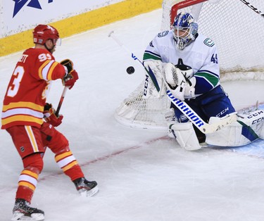 Vancouver Canucks goaltender Braden Holtby stops this shot as Calgary Flames forward Sam Bennett moves in during the Calgary Flames NHL home opener on Saturday, January 16, 2021. 
Gavin Young/Postmedia