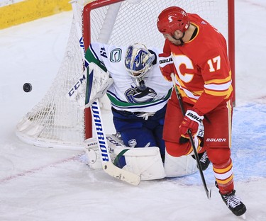 The Calgary FlamesÕ Milan Lucic watches a deflected puck in front of goaltender Braden Holtby during the Calgary Flames NHL home opener against the Vancouver Canucks on Saturday, January 16, 2021. 
Gavin Young/Postmedia