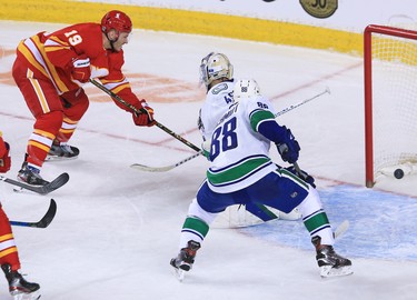 The Calgary Flames’ Matthew Tkachuk scores on Vancouver Canucks goaltender Braden Holtby during the Calgary Flames NHL home opener on Saturday, January 16, 2021. The Flames won 3-0
Gavin Young/Postmedia