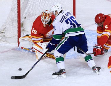 Calgary Flames goalie Jacob Markstrom stops this scoring chance by the Vancouver Canucks’ Nils Hoglander during the Calgary Flames NHL home opener on Saturday, January 16, 2021. 
Gavin Young/Postmedia