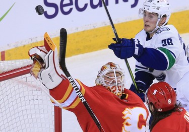 Calgary Flames goalie Jacob Markstrom deflects a shot by the Vancouver Canucks  during the Calgary Flames NHL home opener on Saturday, January 16, 2021. 
Gavin Young/Postmedia