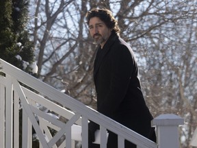 Prime Minister Justin Trudeau walks up the front steps of Rideau Cottage following a news conference in Ottawa, Friday, January 8, 2021.