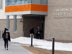 Students are seen outside Joane Cardinal Schubert High School in the SW on Tuesday, Jan. 19, 2021.