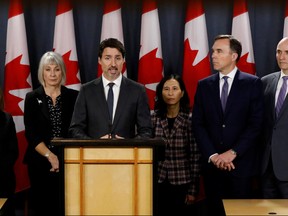Canada's Prime Minister Justin Trudeau, with Deputy Prime Minister Chrystia Freeland (L), Minister of Health Patty Hajdu, Chief Public Health Officer Dr. Theresa Tam, Minister of Finance Bill Morneau, and Treasury Board President Jean-Yves Duclos (R), attends a news conference in Ottawa, Ontario, Canada March 11, 2020.