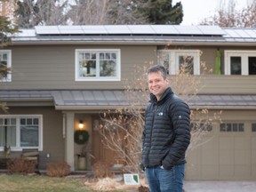 Eric Hyndman adds solar panels to his 1960s-era home, along with other energy efficient renovations.