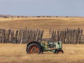 An old tractor sits in the winter grass west of Stavely, Ab., on Tuesday, January 19, 2021.