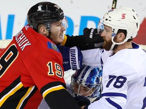 Calgary Flames Matthew Tkachuk battles against T.J. Brodie of theToronto Maple Leafs in front of Leafs goaltender Jack Campbell during NHL hockey in Calgary on Sunday January 24, 2021. Al Charest / Postmedia