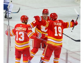 Calgary Flames sniper Johnny Gaudreau celebrates with teammates Sean Monahan and Matthew Tkachuk after scoring a goal against the Toronto Maple Leafs during NHL action in Calgary on Tuesday night. Photo by Al Charest/Postmedia.