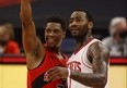 Toronto Raptors guard Kyle Lowry and Houston Rockets guard John Wall talk after Friday's game.